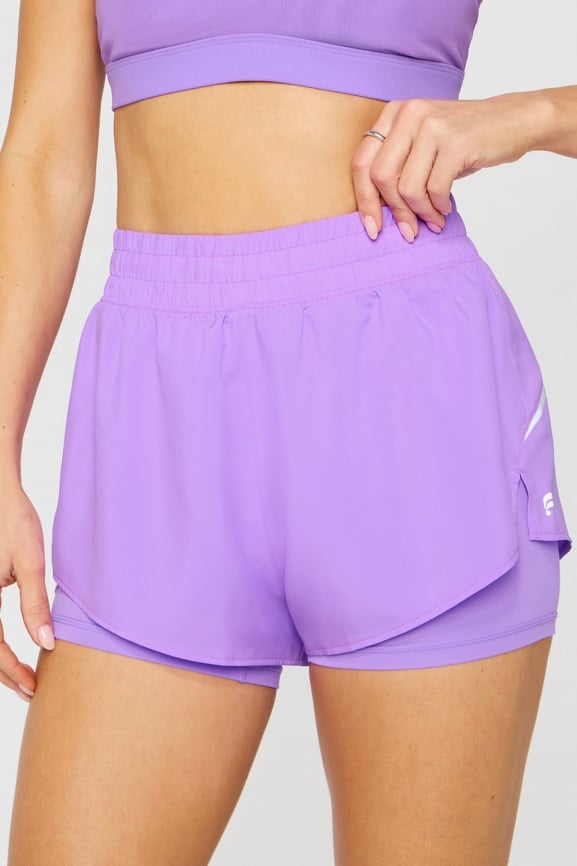 Short de running reflectante 5 cm 2 en 1