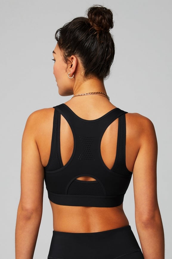 Demi Lovato for Fabletics neon, black, and navy sports bra, twist from  hoodie, and leggings
