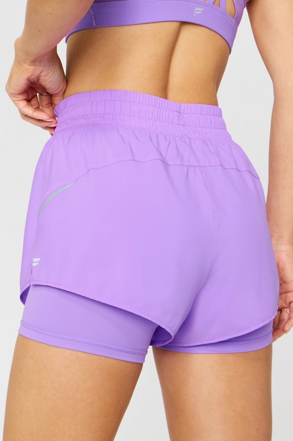 Short de running reflectante 5 cm 2 en 1